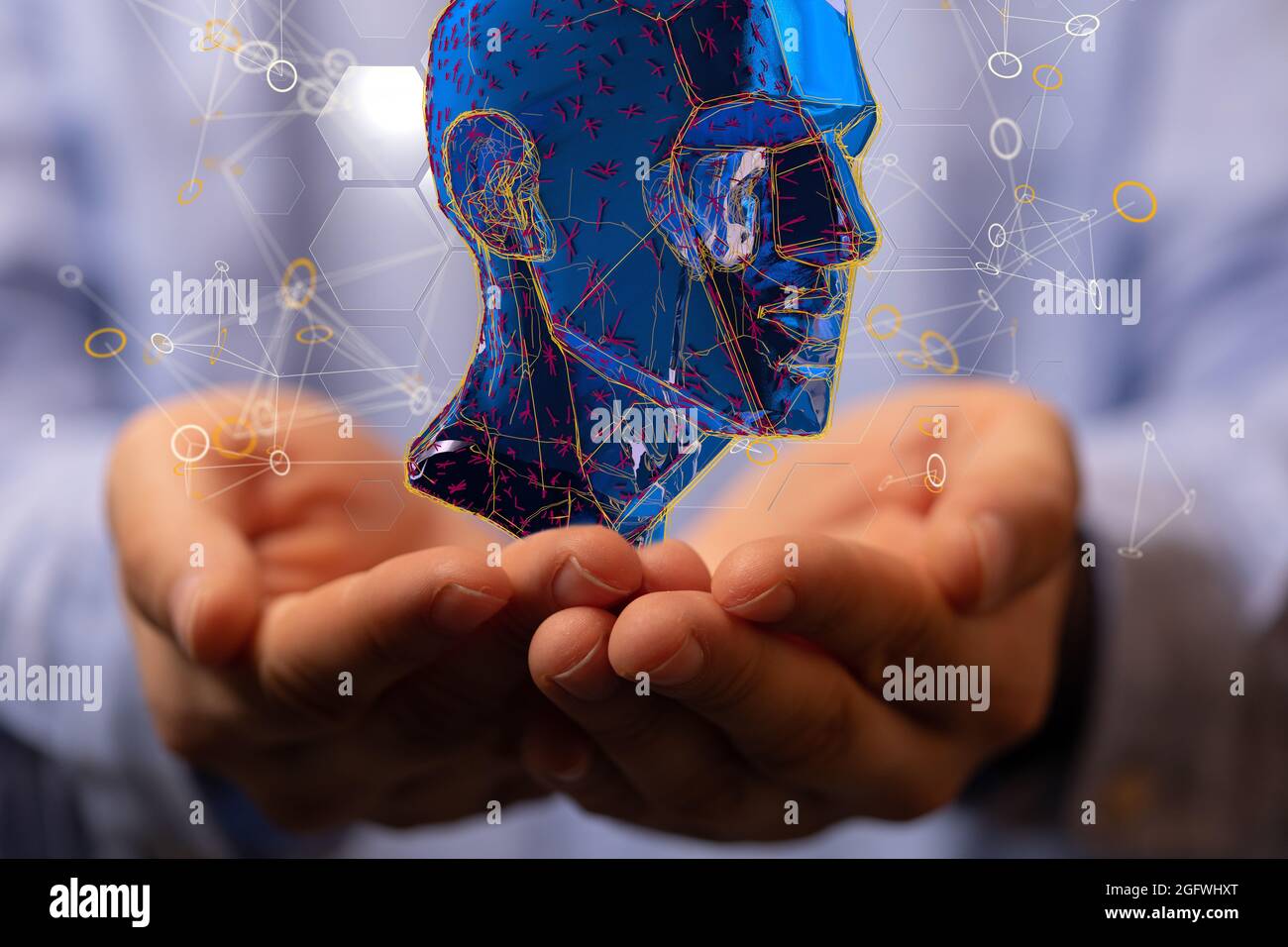 Holding an illustration of a human head- the concept of artificial ...