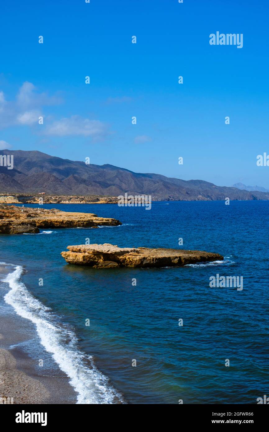 detail of Playa de la Galera beach, in Aguilas, in the Costa Calida coast, Region of Murcia, Spain, with the Calnegre mountain range in the background Stock Photo