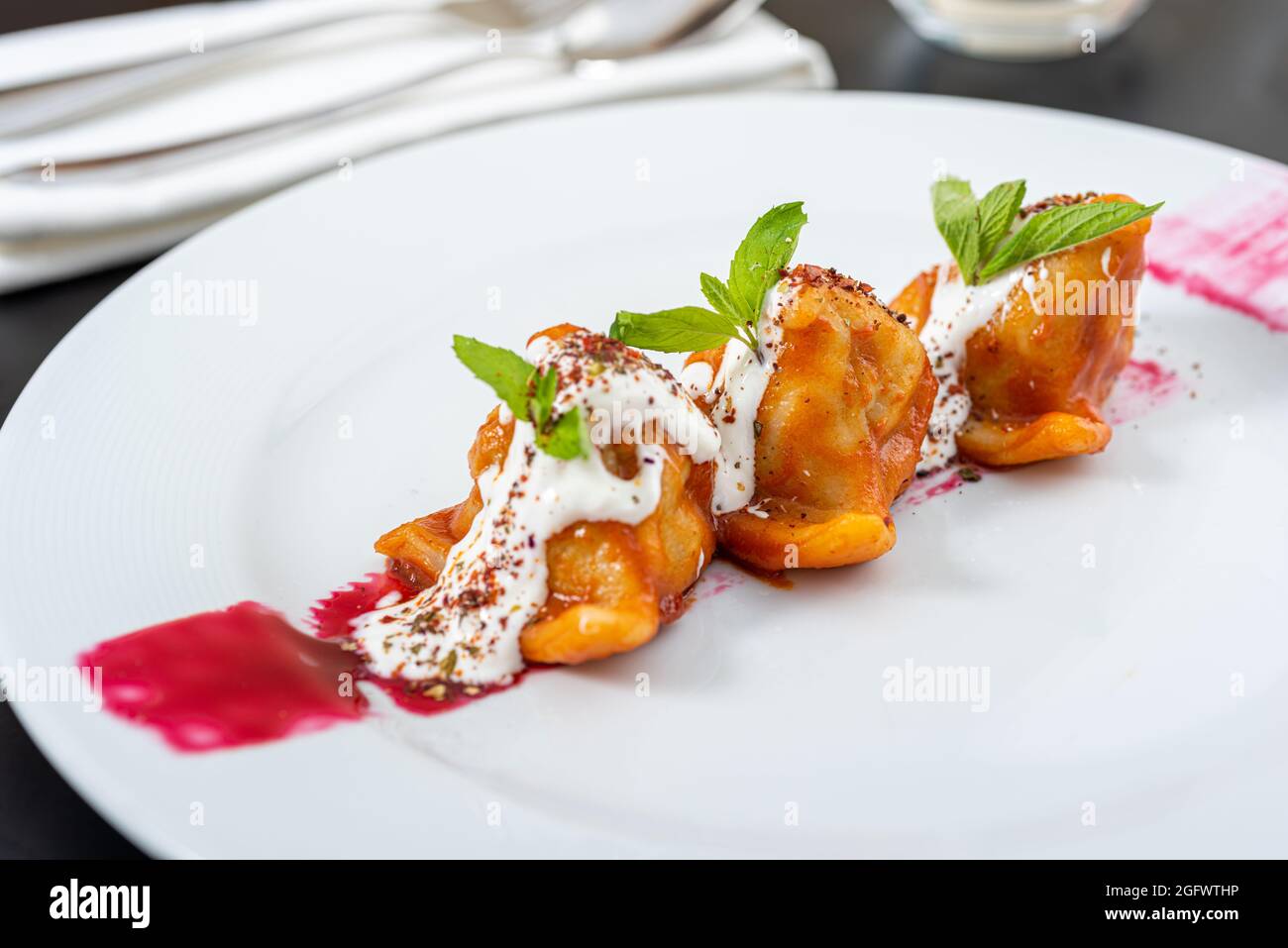 Steamed meat dumplings, traditional pelmeni or varenyky dish Stock Photo -  Alamy