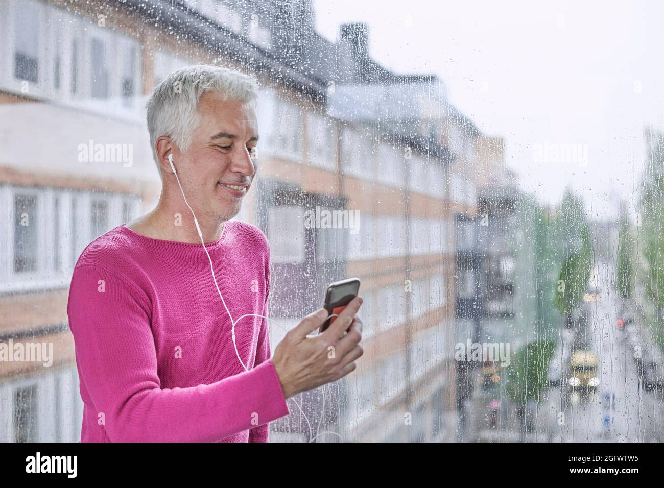 Smiling man having video call via smartphone Stock Photo