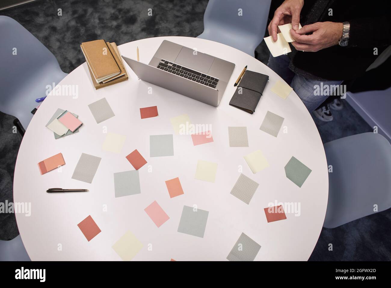 Sticky notes and laptop on table in office Stock Photo
