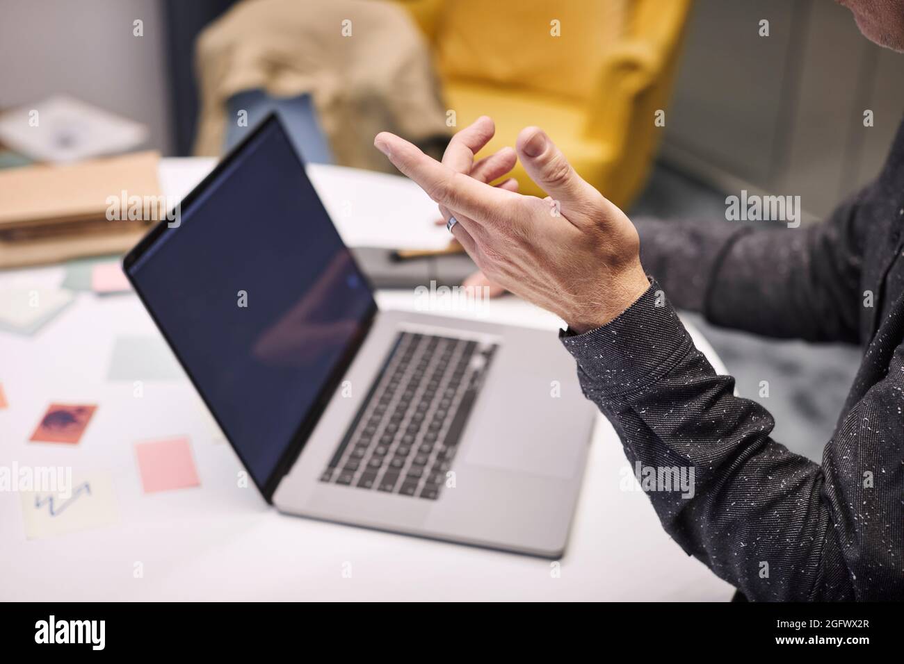 Businessman using laptop in office Stock Photo