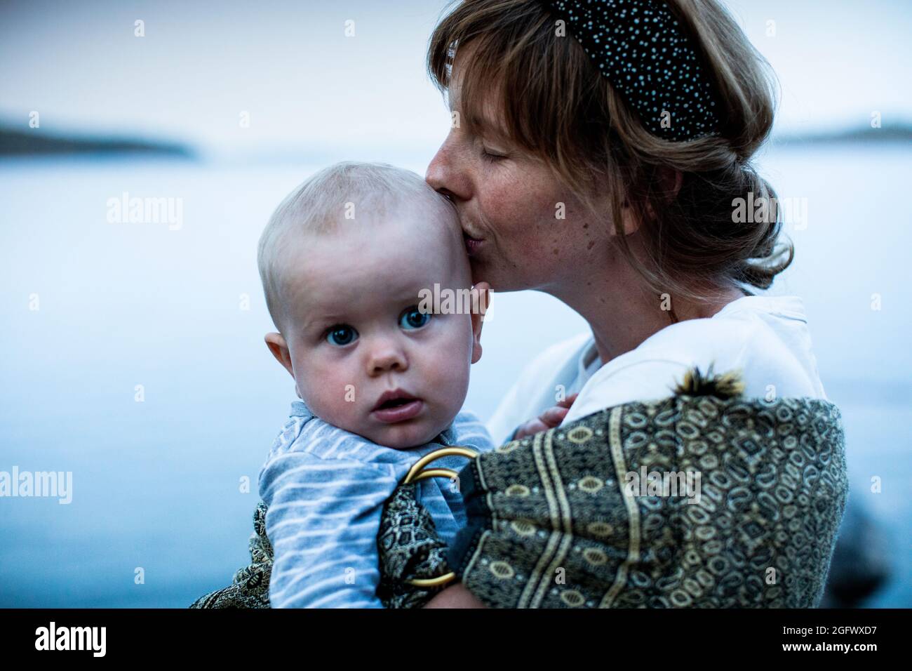 Mother holding baby boy Stock Photo