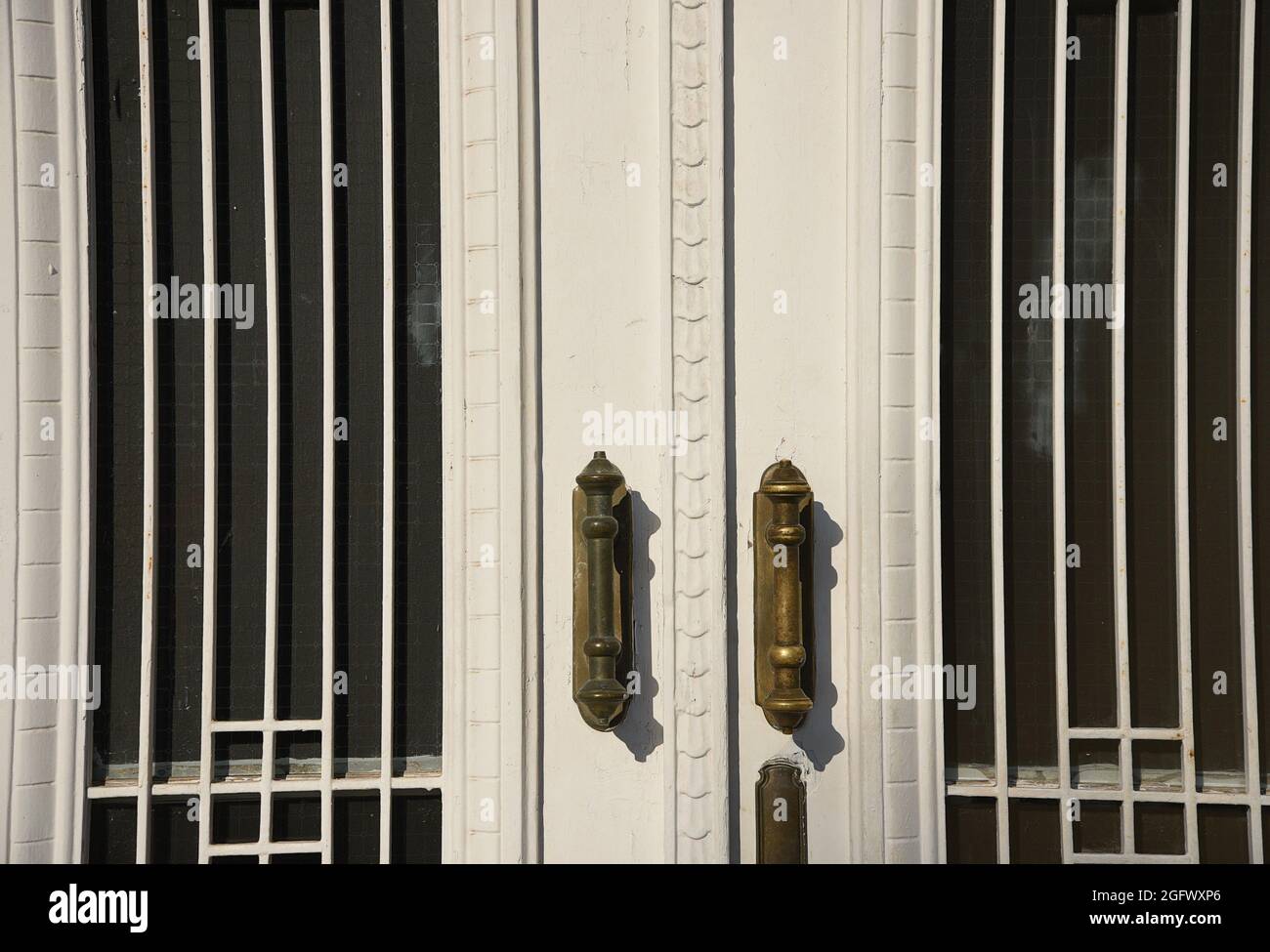 Old Neoclassical house white wooden entrance door with matching grilles