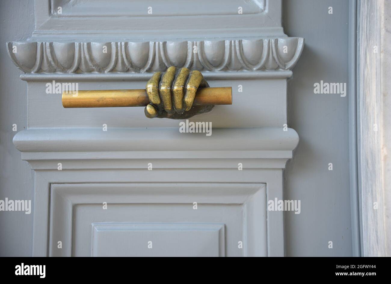 Old Neoclassical house white wooden entrance door with an antique brass