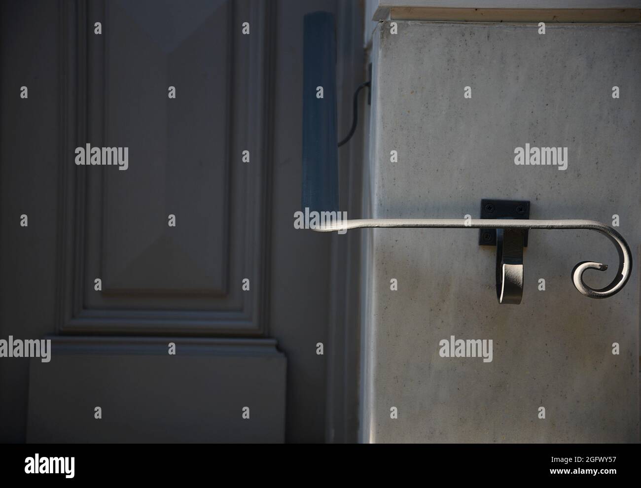 Traditional house grey wooden entrance door with a white marble trim