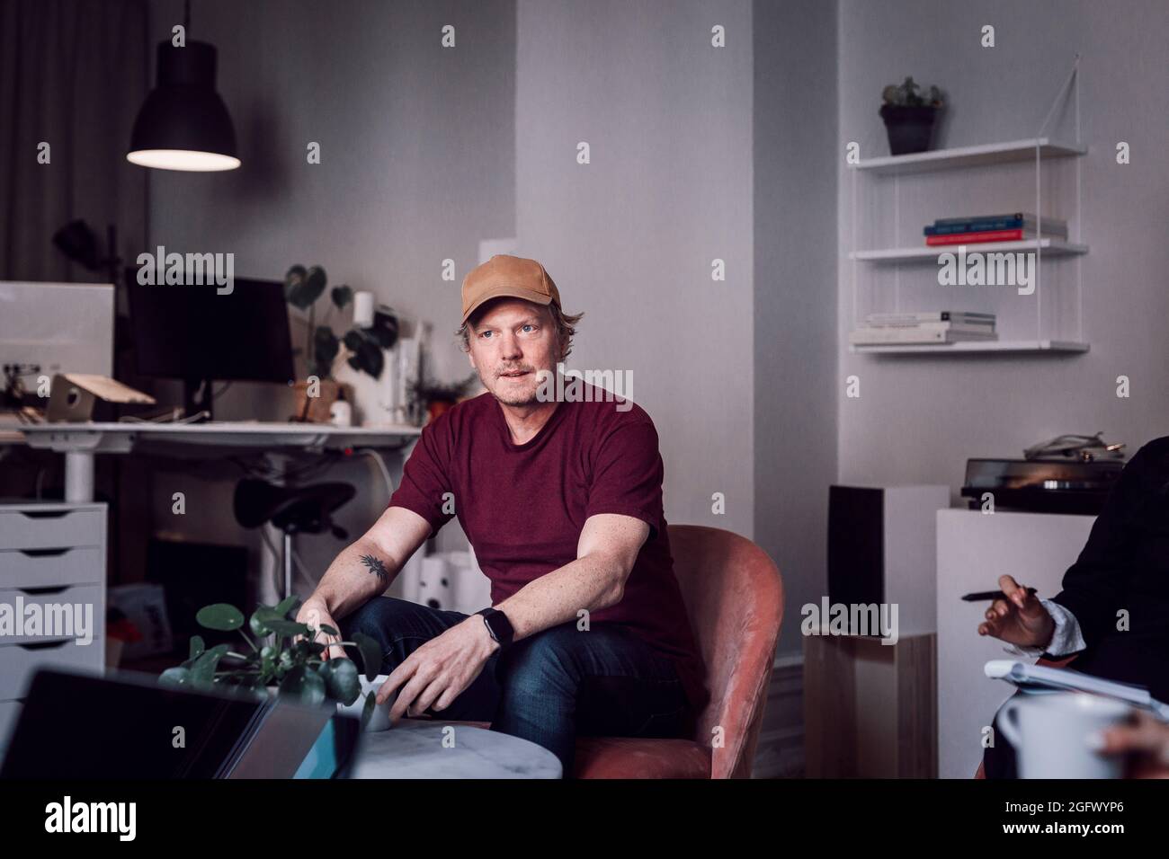 Mature man sitting in office Stock Photo