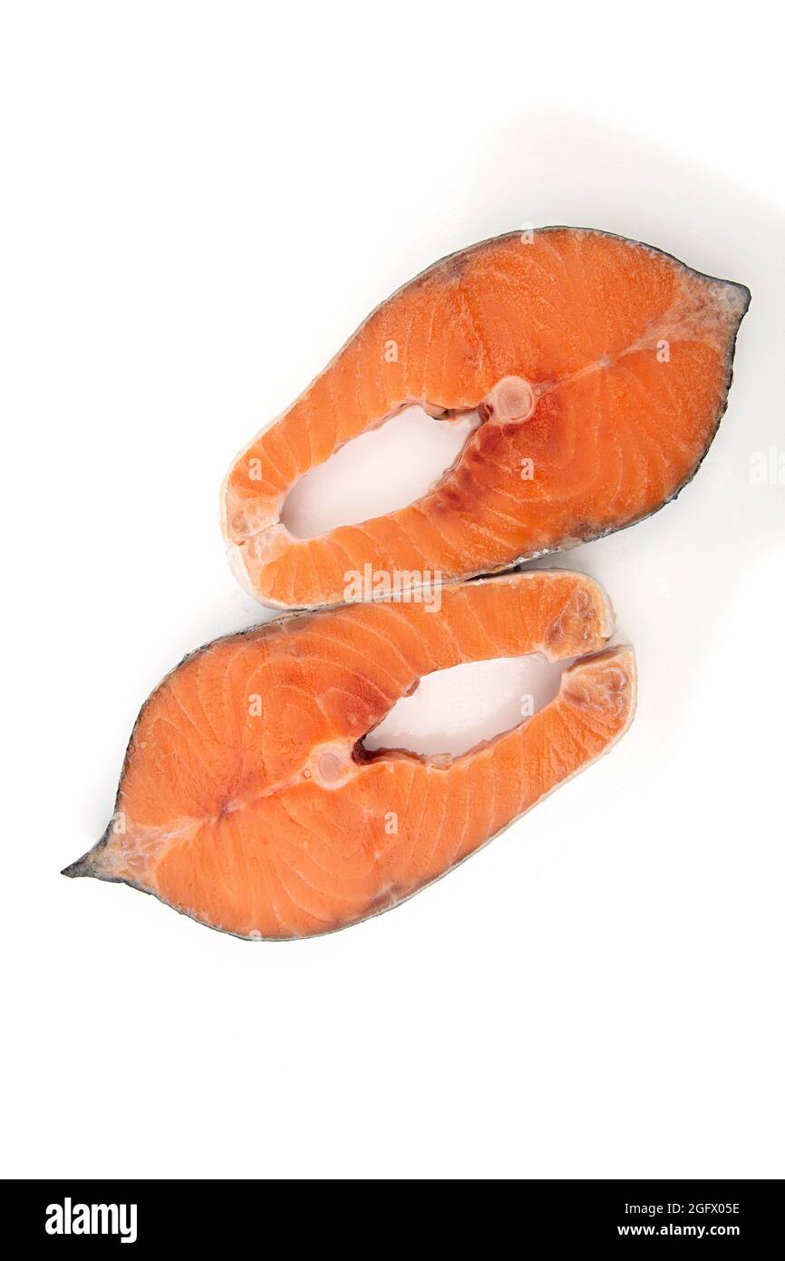Raw salmon fish steak on a white background Stock Photo - Alamy