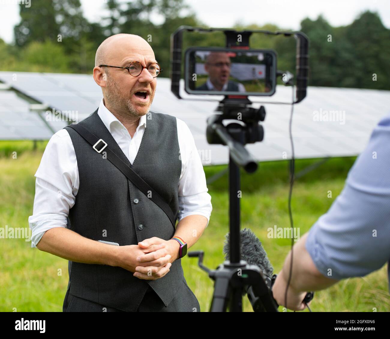 Edinburgh, Scotland, UK. 27th Aug, 2021. PICTURED: Scottish Greens co-leaders Patrick Harvie and Lorna Slater visit the site of a new solar farm at the University of Edinburgh Easter Bush Campus to discuss how the proposed co-operation agreement between the party and the Scottish Government will allow Greens to champion a bold response to climate crisis. Credit: Colin Fisher/Alamy Live News Stock Photo