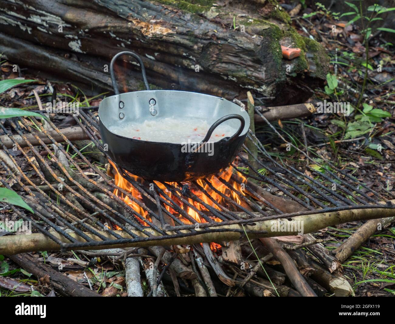 Cooking on the fireplece on the camp in the amazons jungle. Amazonia. Brazil. South America. Stock Photo