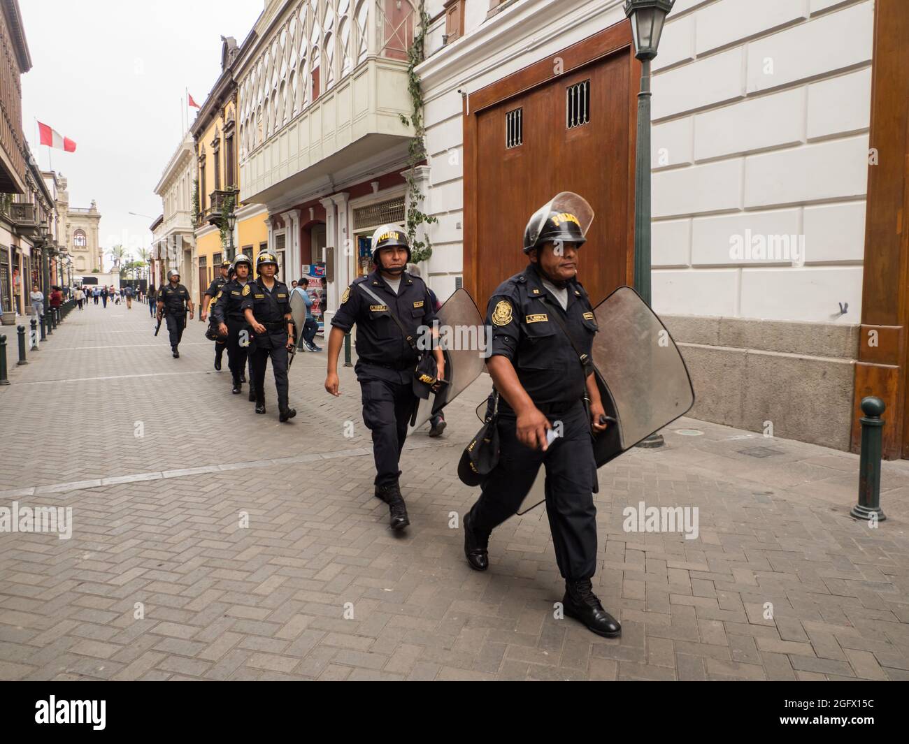 Lima, Peru - Dec,  2019: Policemen in the helmets on the streets of Lima. Policia. South America. Stock Photo