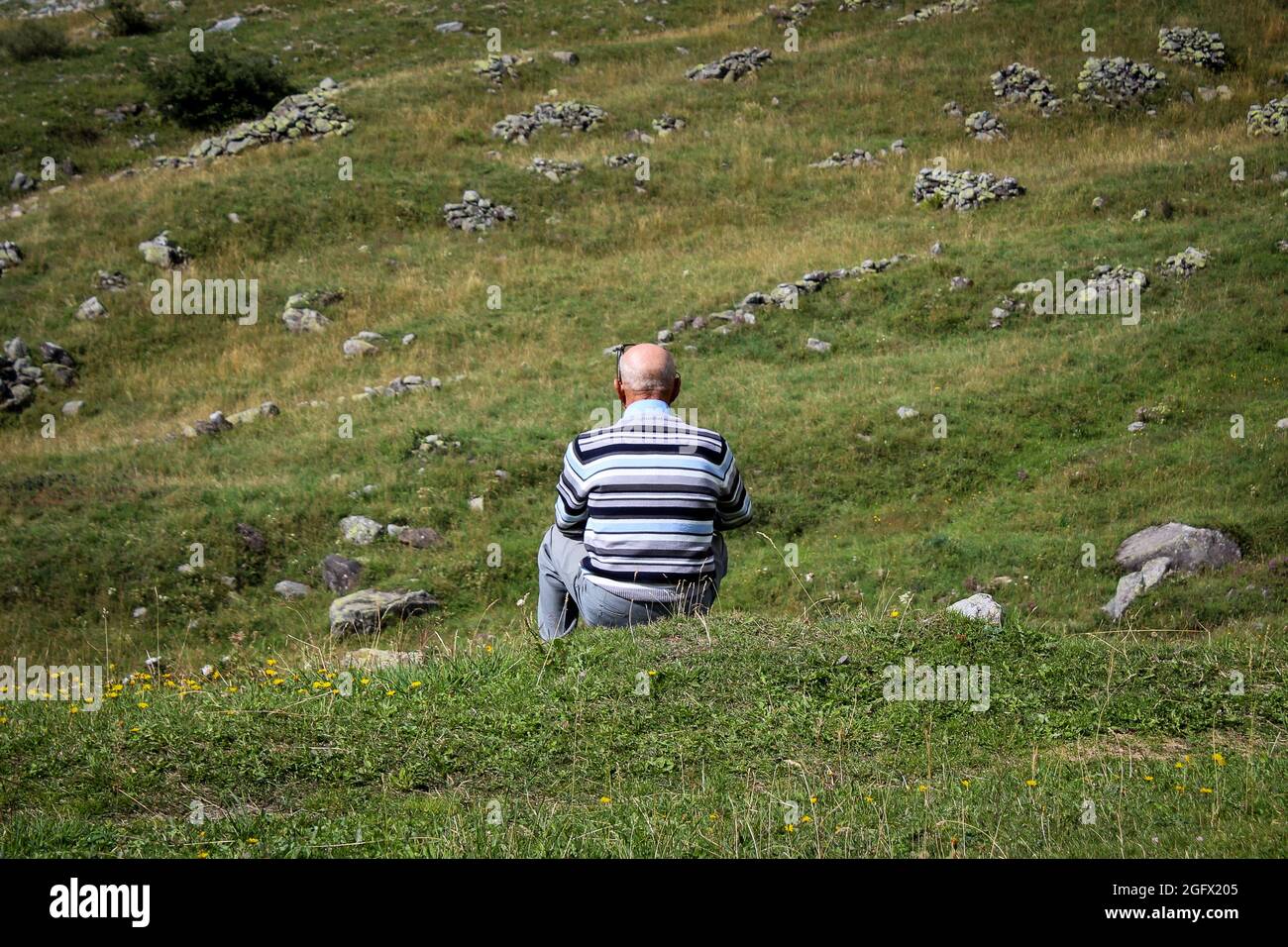 Sad Man Sitting On Rocks Hi-res Stock Photography And Images - Alamy