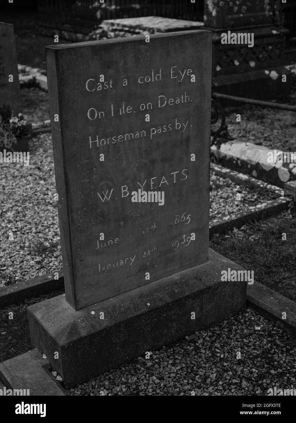 The headstone at the grave of W.B. Yeats in Sligo, Ireland, engraved with the line Cast a cold Eye On Life, on Death. Horseman, pass by! Stock Photo