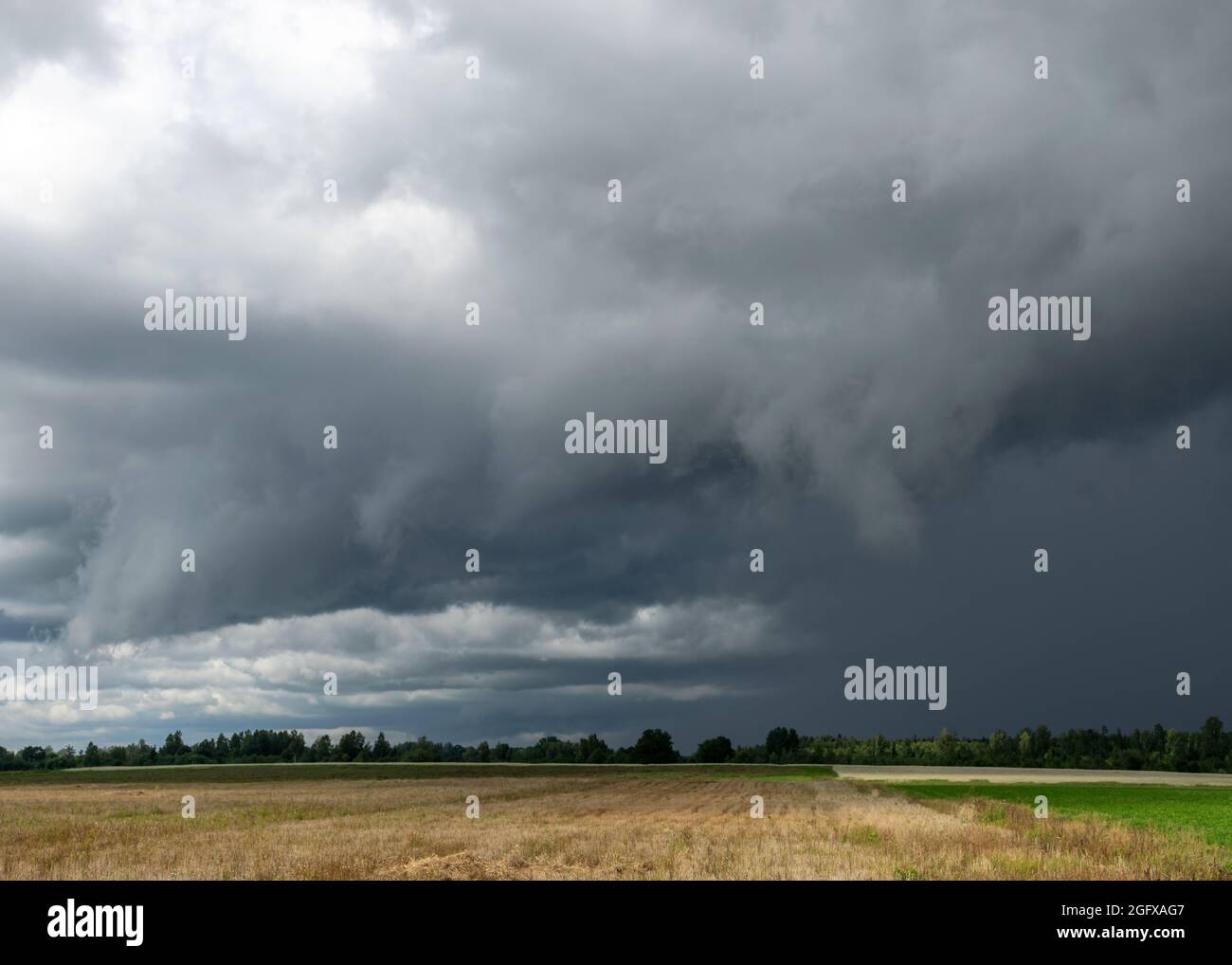 rural landscape with storm clouds, contrasting colors in nature before ...