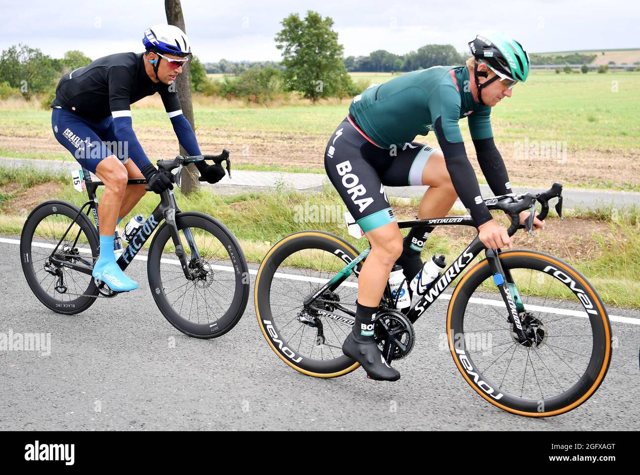 Sangerhausen, Germany. 27th Aug, 2021. Cycling: Tour of Germany, stage 2,  Sangerhausen - Ilmenau. Pascal Ackermann (r) from Team Bora-hansgrohe and  Reto Hollenstein from Team Israel Start-Up Nation in action. Credit: Bernd