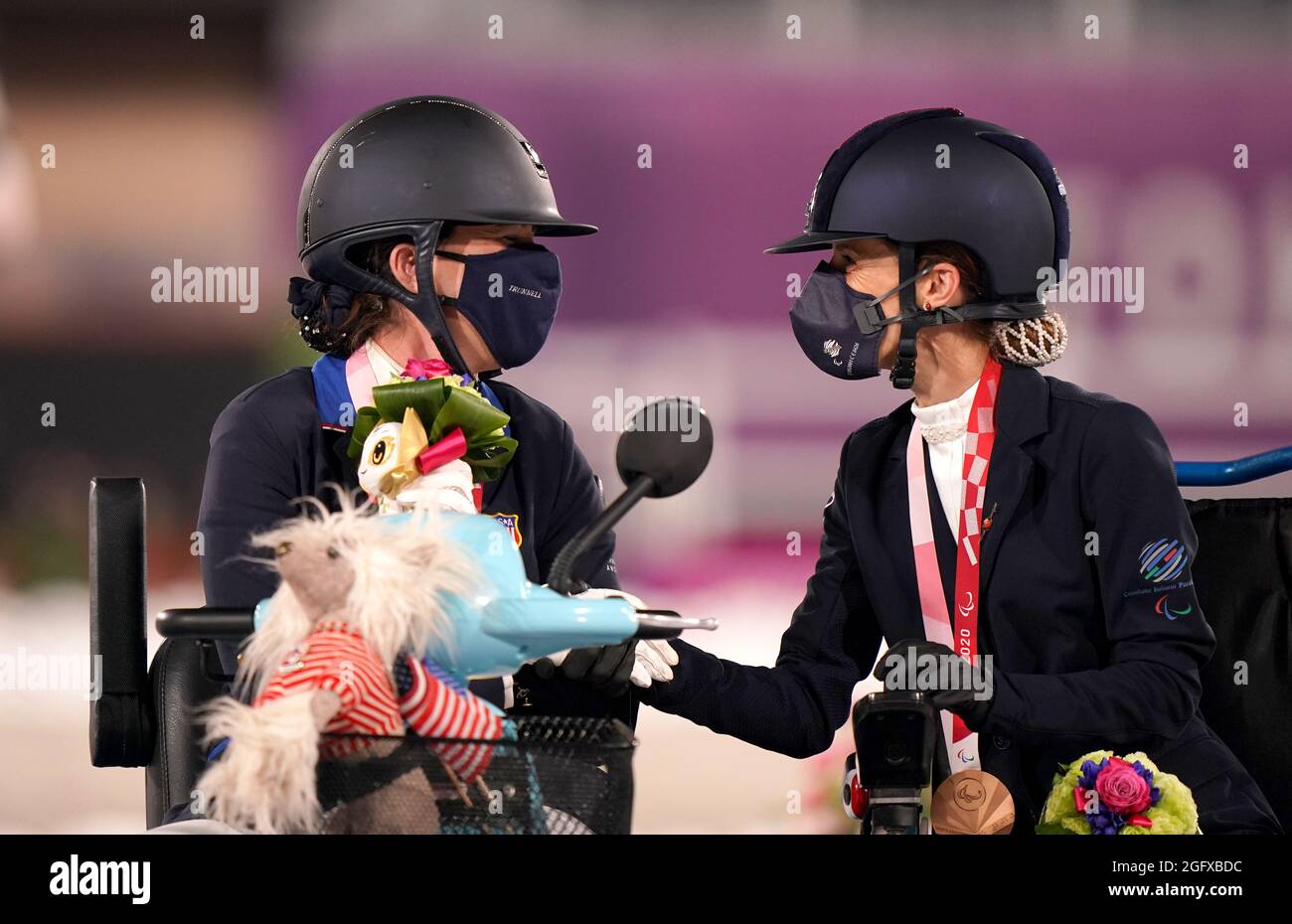 USA's Roxanne Trunnell is congratulated by third placed Italy's Sara Morganti (right) after winning the Dressage Individual Test - Grade One at the Equestrian Park during day three of the Tokyo 2020 Paralympic Games in Japan. Picture date: Friday August 27, 2021. Stock Photo