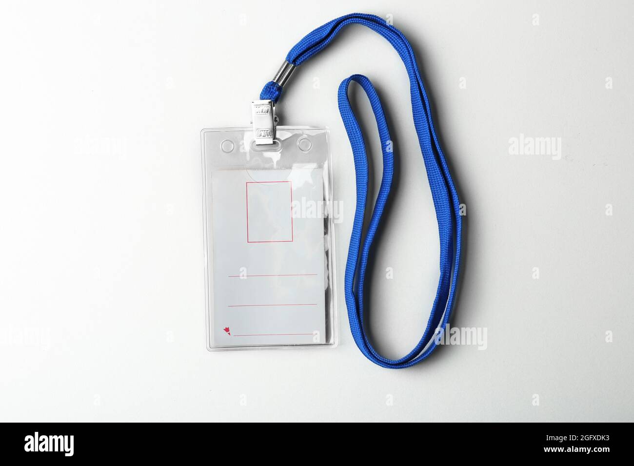 Blank badge with lanyard on white background Stock Photo - Alamy