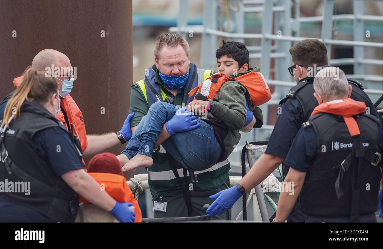 England, Kent, Dover, Border Force officers landing Asylum Seekers picked up in the English Channel. Stock Photo