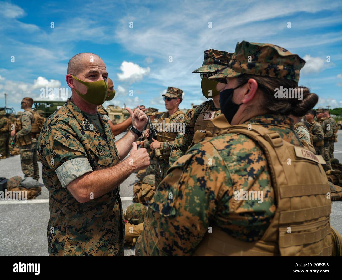 U.S. Marine Corps Col. Christopher Haar, commanding officer of Combat Logistics Regiment 3, 3d Marine Logistics Group, inspects Navy Corpsman during an integrated rapid response inspection at Kadena Air Base, Okinawa, Japan, August 25, 2021. Routine short-notice inspections ensure III MEF Marines remain ready to rapidly deploy and maintain regional security in the Indo-Pacific. 3d MLG, based out of Okinawa, Japan, is a forward deployed combat unit that serves as III Marine Expeditionary Force’s comprehensive logistics and combat service support backbone for operations throughout the Indo-Pacif Stock Photo