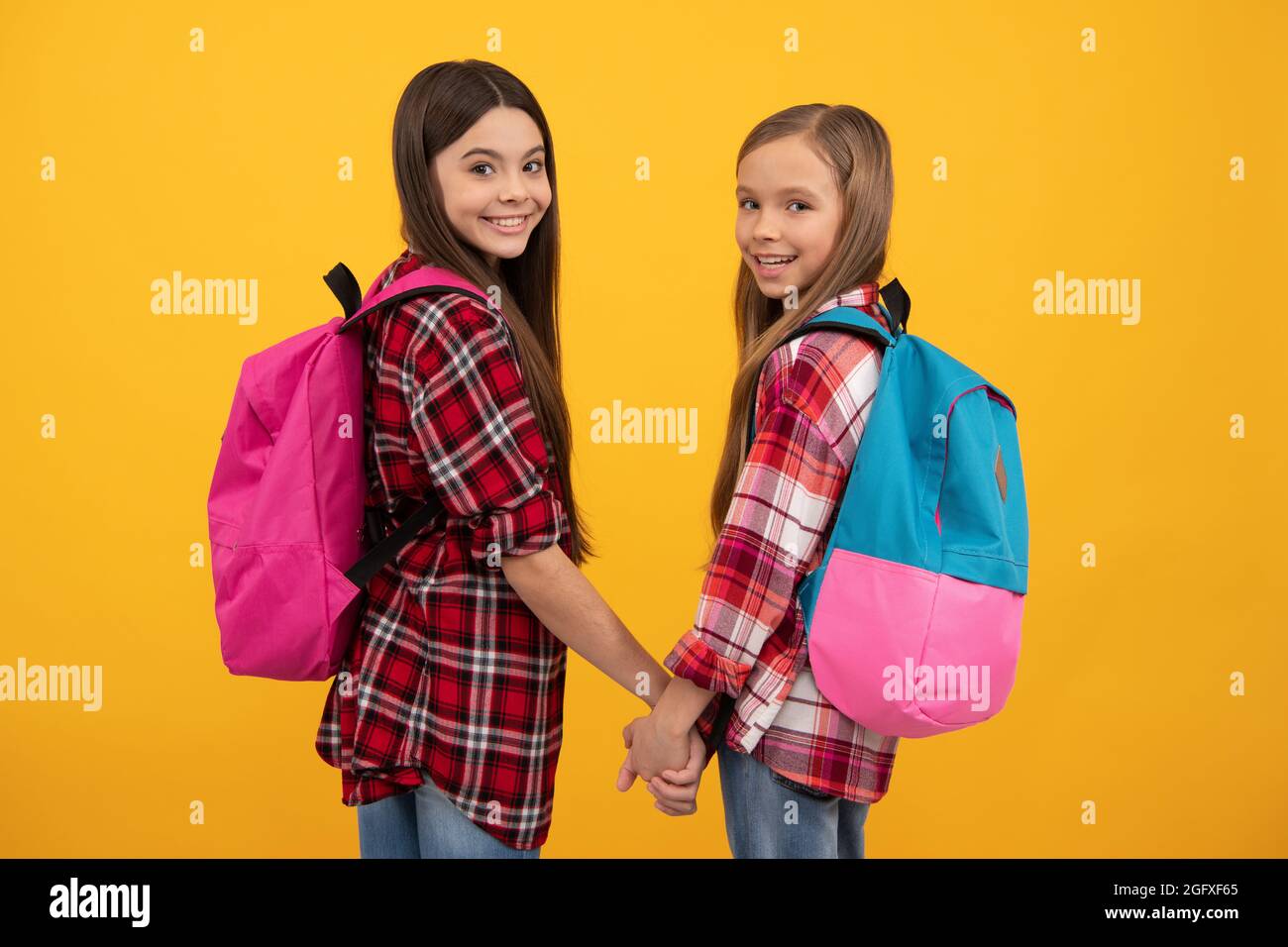 happy childhood. children with school bag. cute teen girls carry