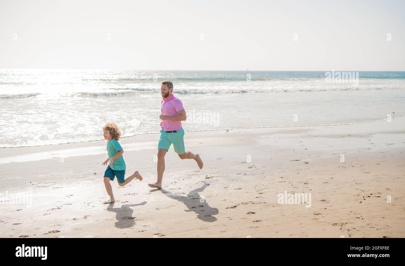 Happy family running on beach hi-res stock photography and images - Alamy