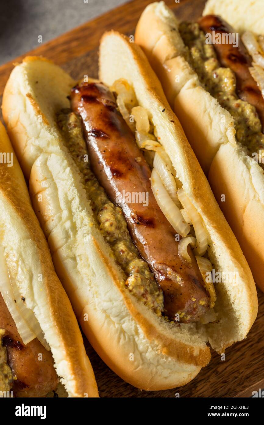Homemade German Bratwurst Sandwich with Mustard and Onion Stock Photo