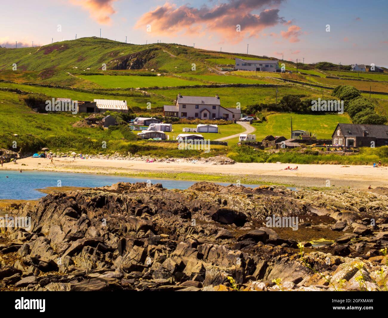 Tiny beach in West Cork in the shadow of green hills. Co.Cork, Ireland Stock Photo Alamy