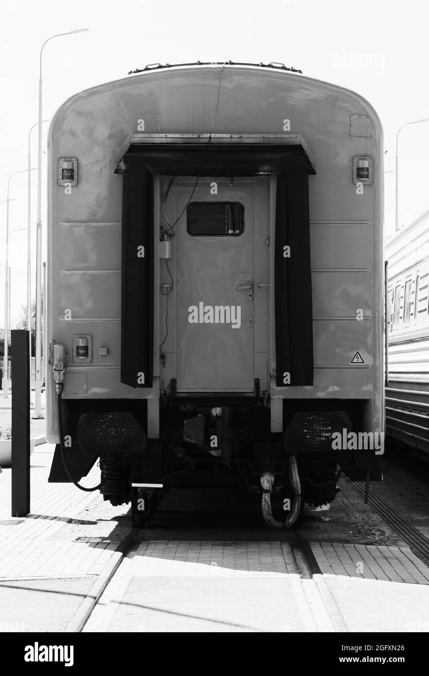 The last railway car of a passenger train, close up  black and white front view photo Stock Photo