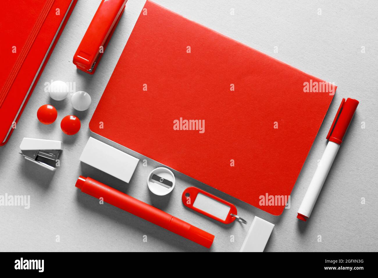 Red stationery on light background Stock Photo Alamy