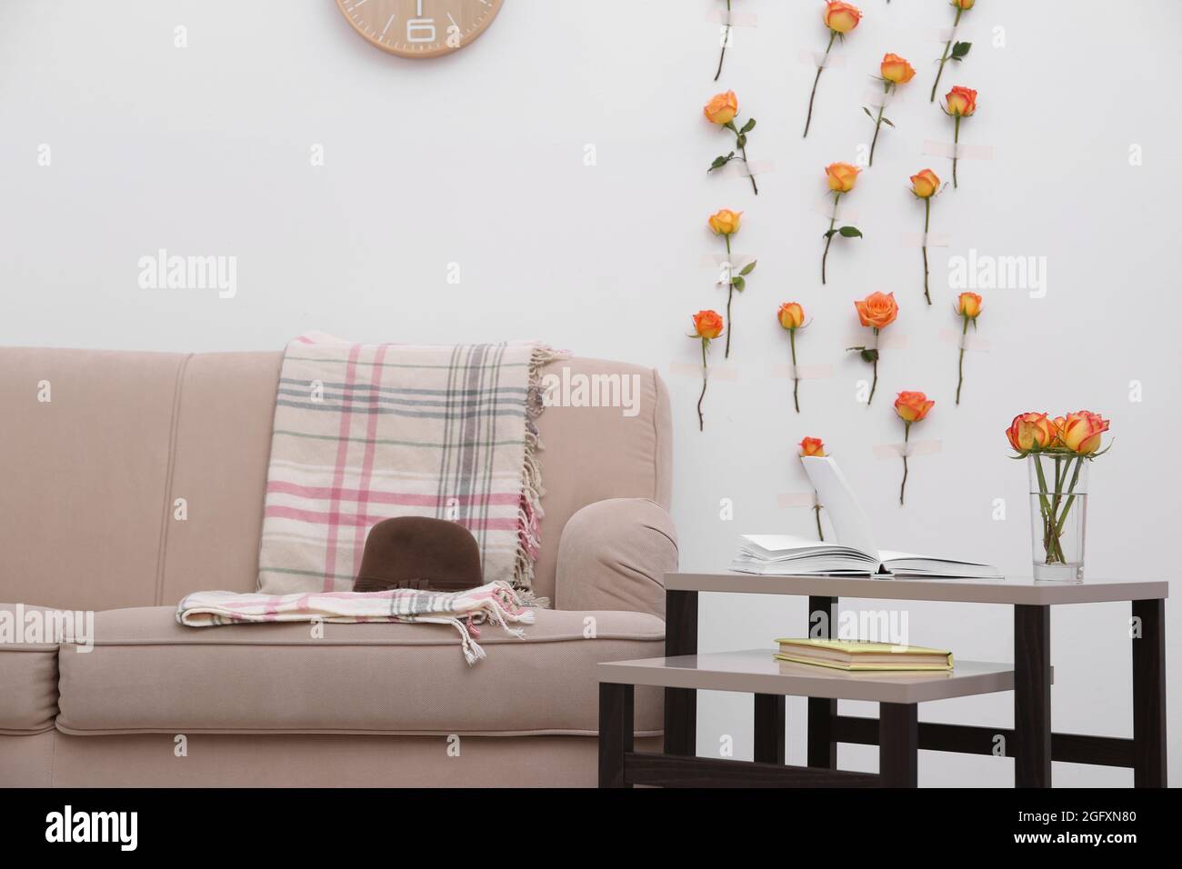 Interior of beautiful living room decorated with flowers Stock Photo ...