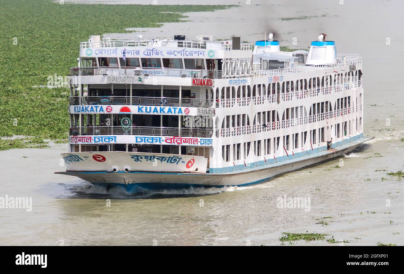 Local Passenger ferry returning to Dhaka river port. Ferry is a very important means of communication with the southern part of Bangladesh Stock Photo