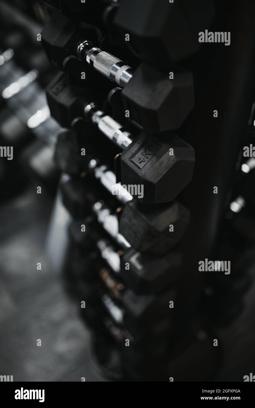 Vertical shot of black dumb-bell Stock Photo