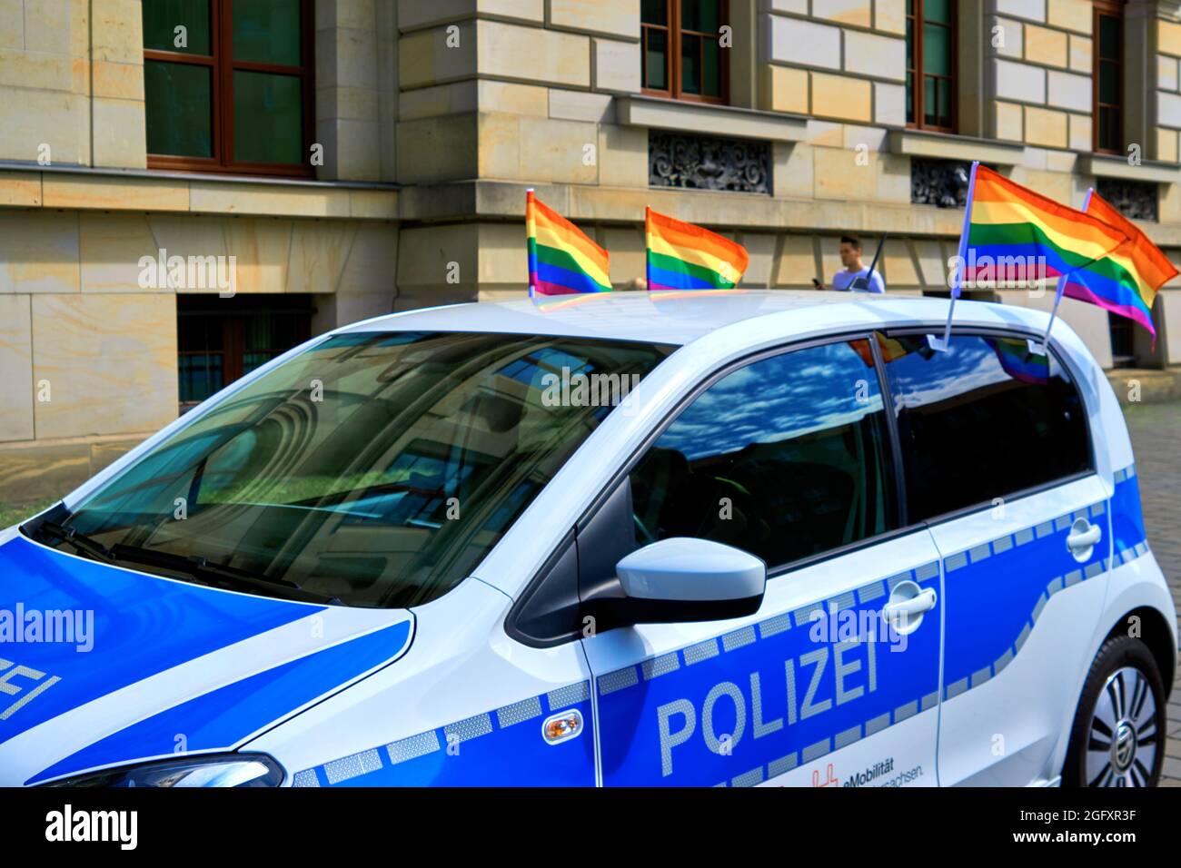Braunschweig, Germany, August 14, 2021: Police car decorated with rainbow flags while driving at CSD Stock Photo