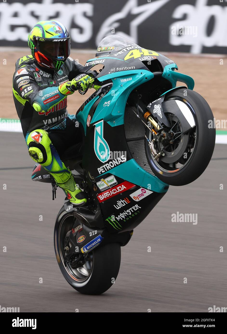 Towcester, England, 27th Aug 2021, Valentino Rossi Petronas Yamaha SRT celebration wheelie during the Monster Energy British Grand Prix MotoGP at Silverstone Circuit, Towcester, England on the 27 to 29 August 2021.