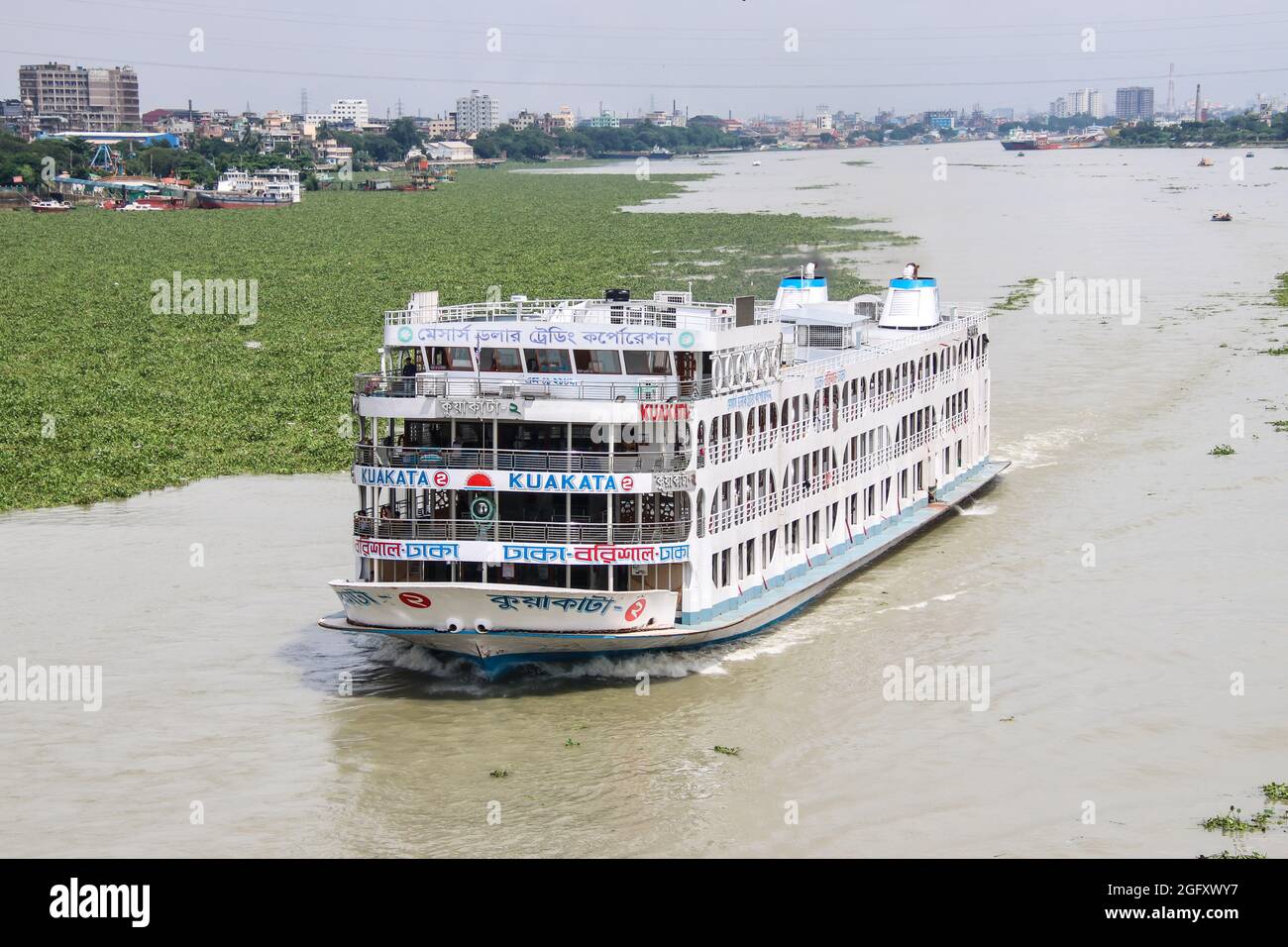 Local Passenger ferry returning to Dhaka river port. Ferry is a very important means of communication with the southern part of Bangladesh Stock Photo