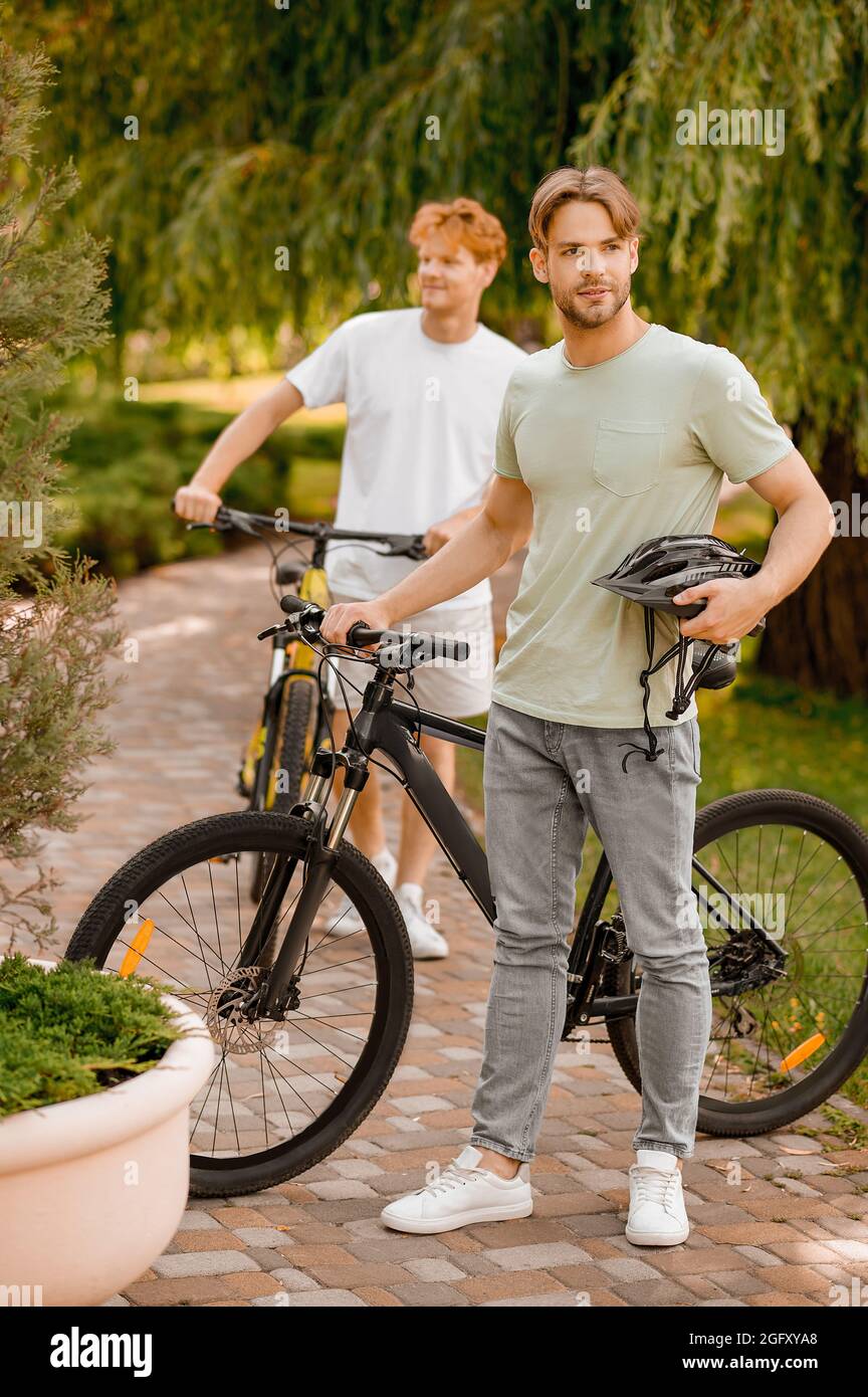 Two recreational cyclists in a local park Stock Photo