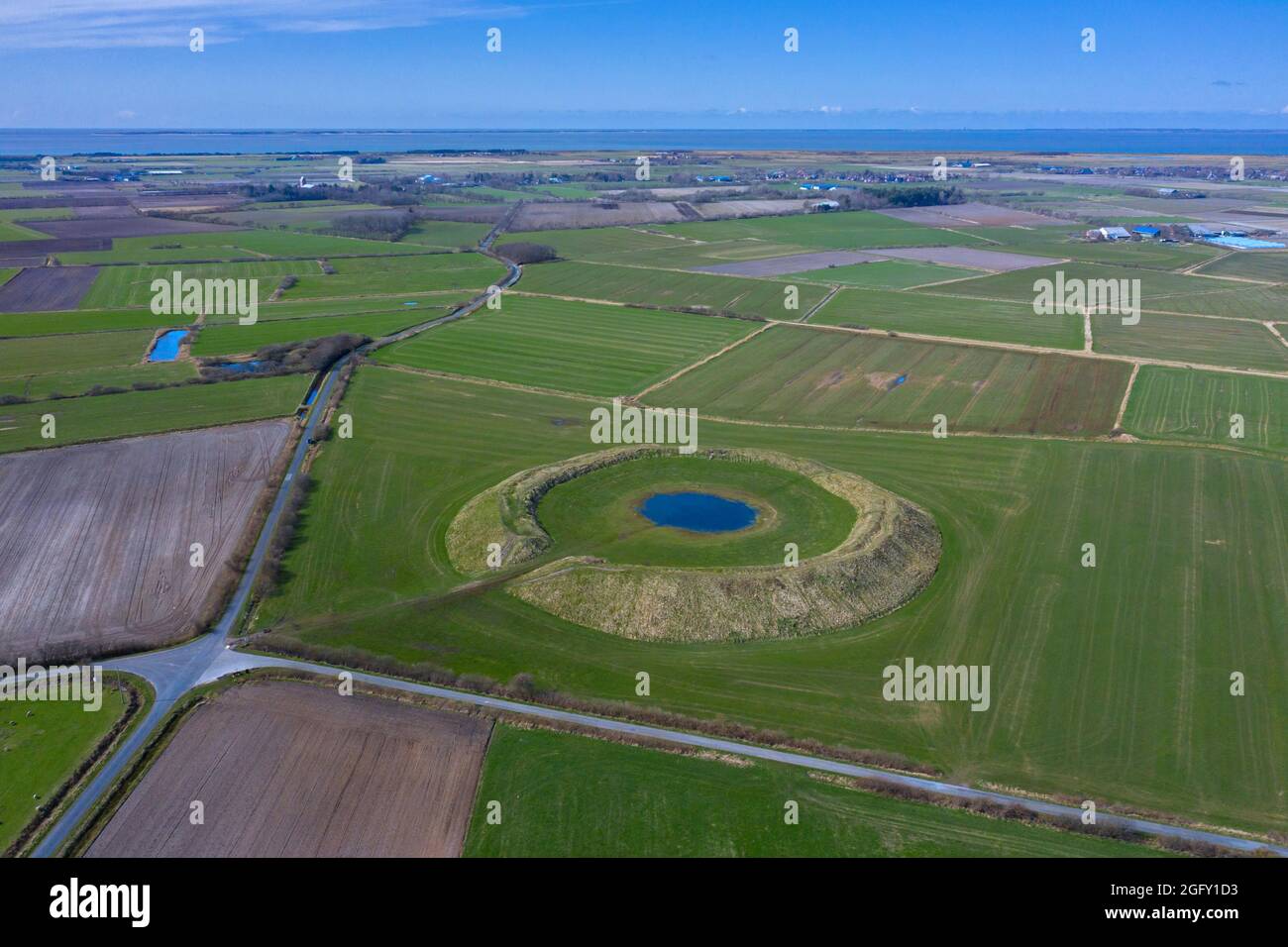 Aerial view over Lembecksburg, medieval ring wall / circular rampart / ringwall near Borgsum on the island Föhr, Schleswig-Holstein, Germany Stock Photo