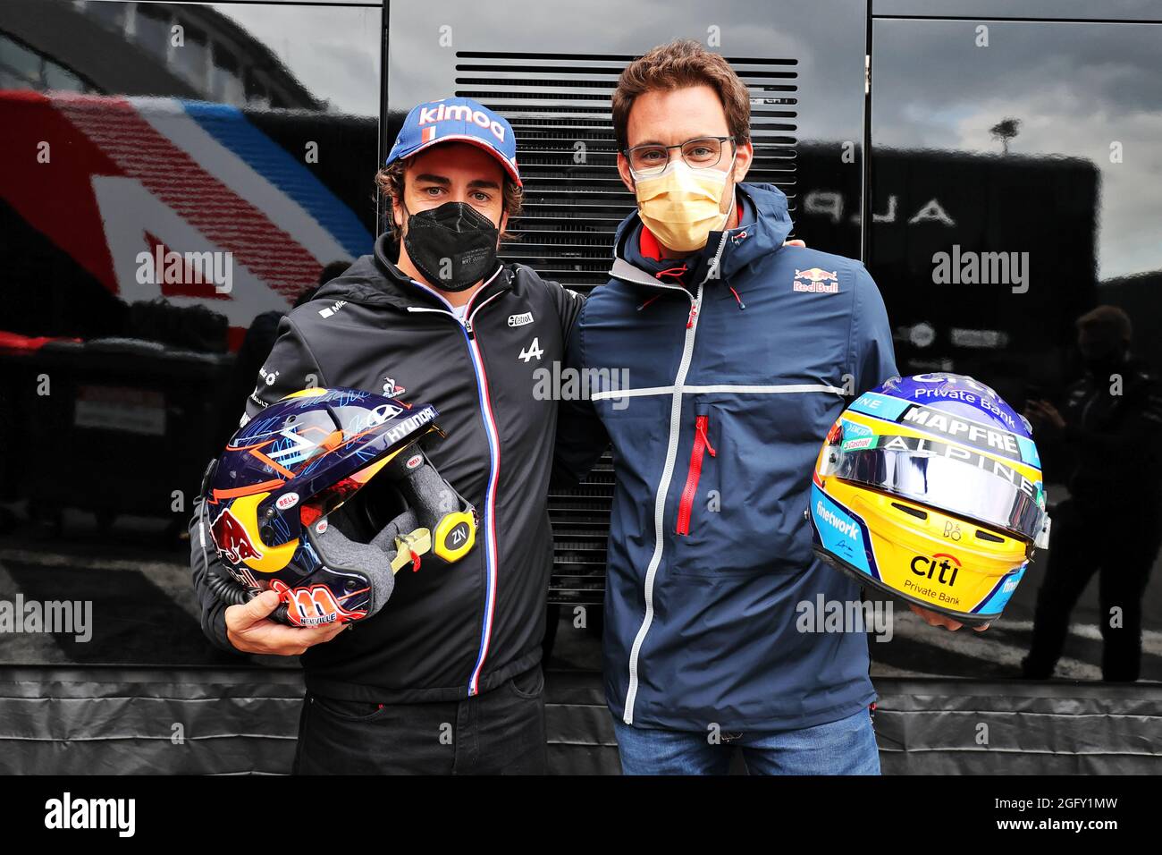 Spa-Francorchamps, Belgium. 27th Aug 2021, (L to R): Fernando Alonso (ESP) Alpine F1 Team swaps helmets with Thierry Neuville (BEL) WRC Rally Driver. Belgian Grand Prix, Friday 27th August 2021. Spa-Francorchamps, Belgium. Credit: James Moy/Alamy Live News Stock Photo