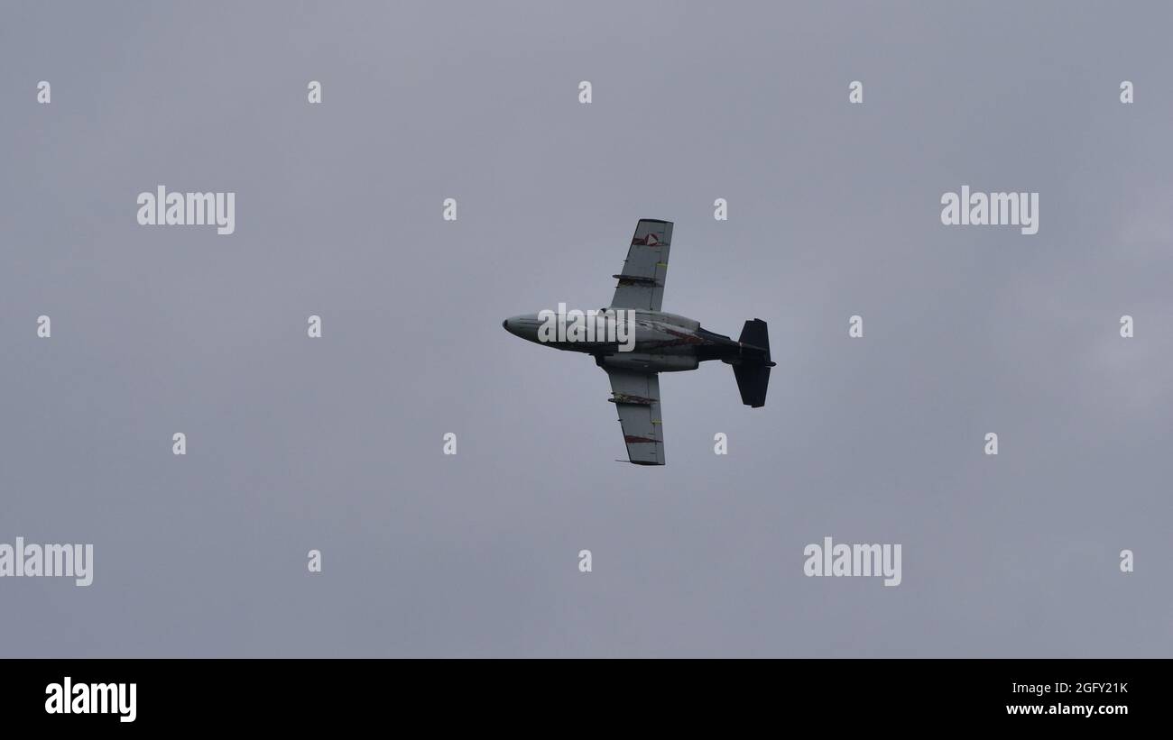 Zeltweg, Austria SEPTEMBER, 6, 2019 Grey military airplane in flight in a cloudy sky. SAAB 105 of Austrian Air Force Stock Photo
