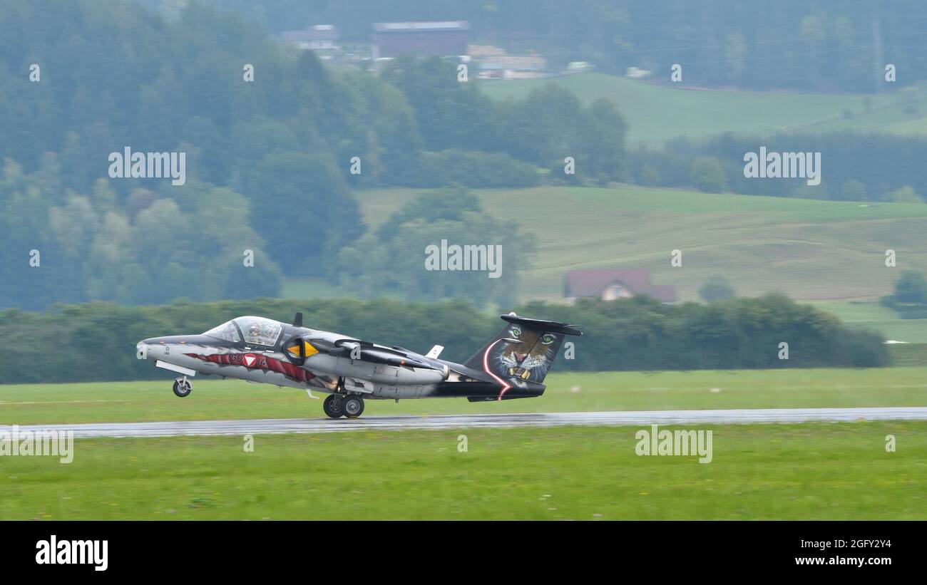 Zeltweg, Austria SEPTEMBER, 6, 2019 Military historic aircraft in special livery landing in a green alpine valley. SAAB 105 of Austrian Air Force Stock Photo