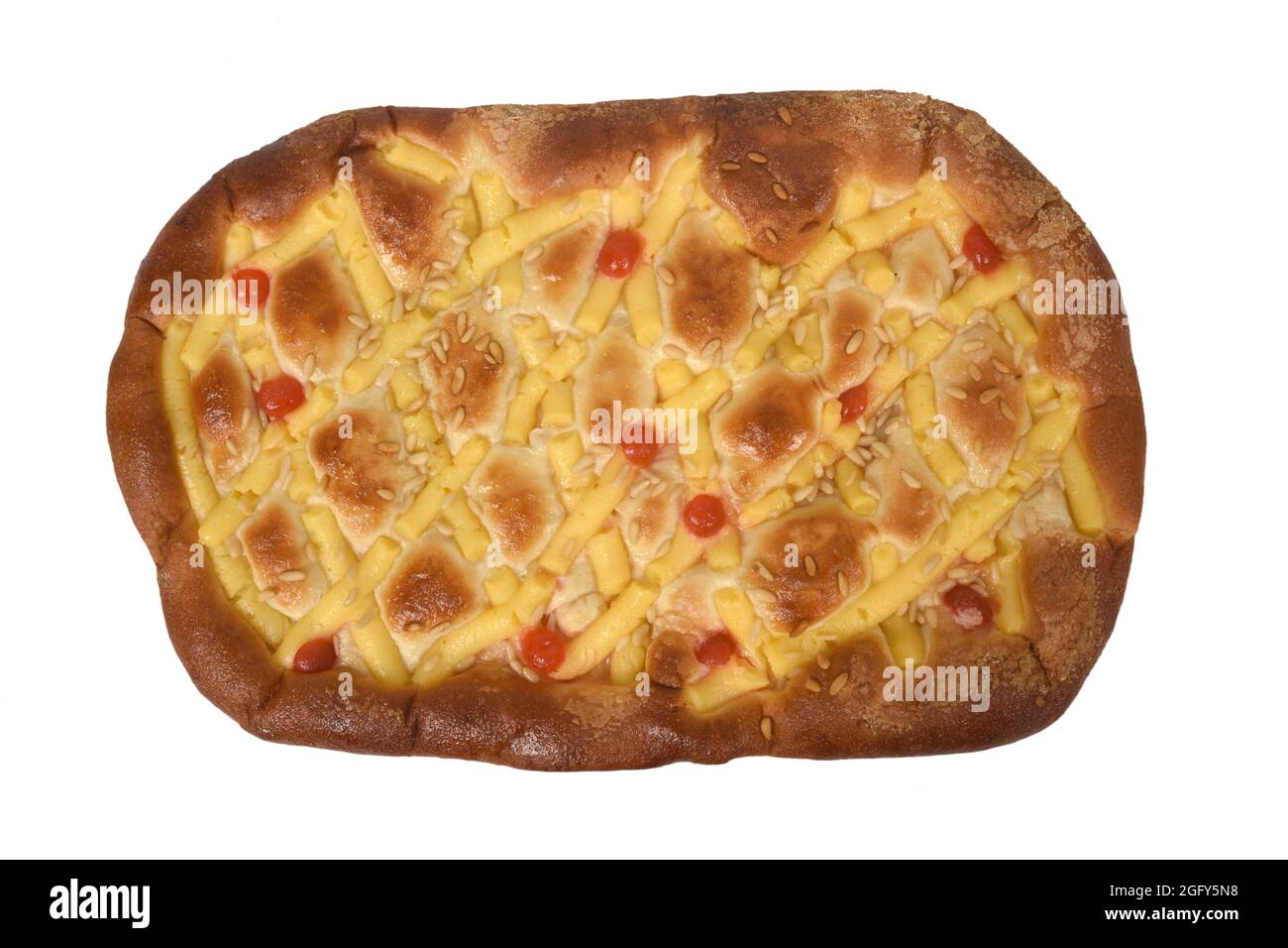 sponge cake of egg cream, pine nuts and cherries on white background Stock Photo