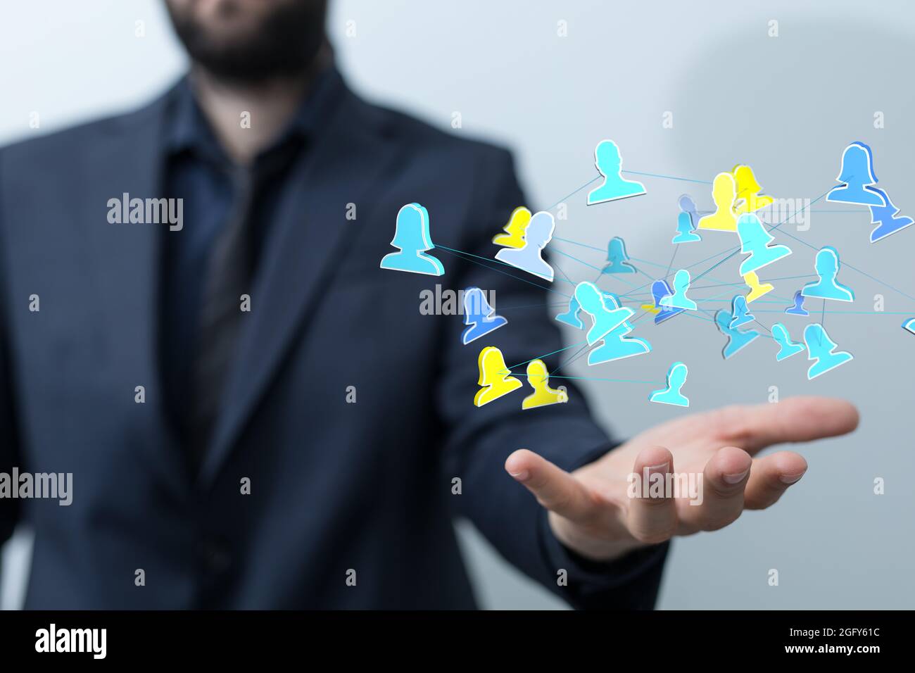 3D rendered people silhouettes held in a person's hand Stock Photo - Alamy
