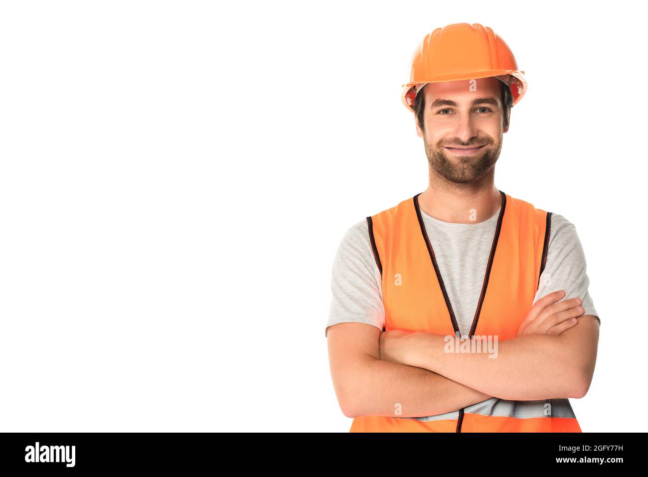 Builder in hard hat and safety vest isolated on white Stock Photo