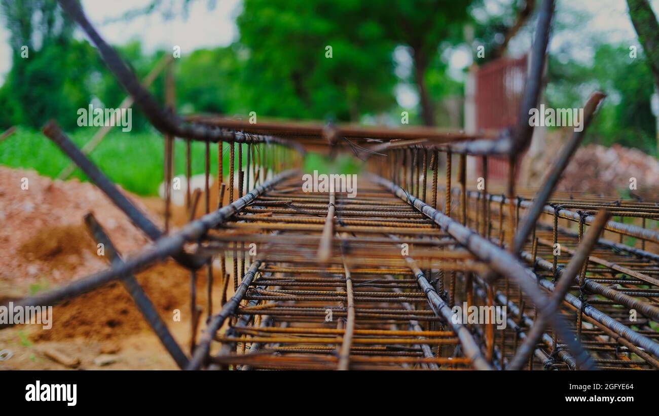 Reinforcing frame of the base plate. Warehouse for building materials for building a house. Rust and corrosion of metal. Stock Photo