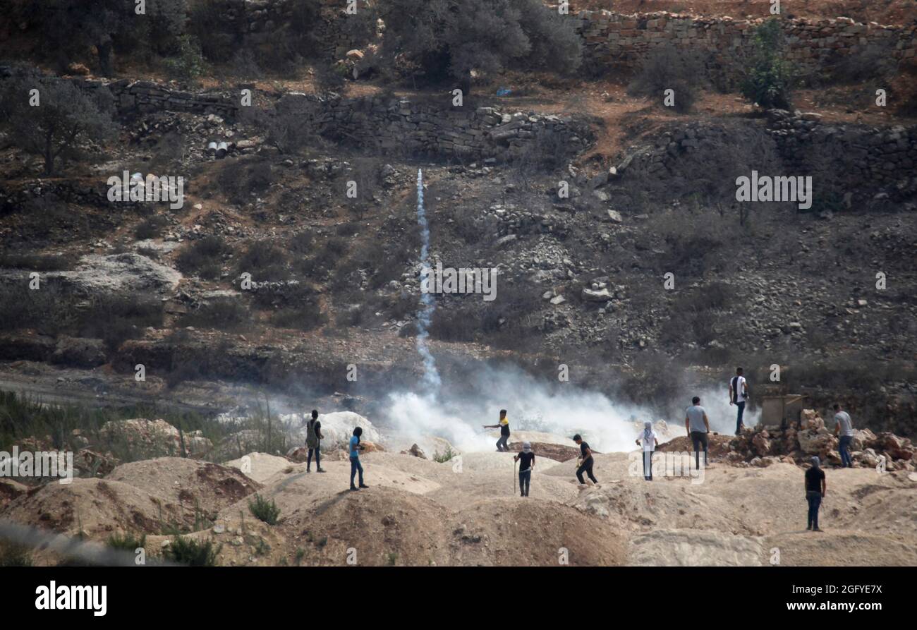 Clashes between Palestinians and Israeli security forces during a demonstration against the Israeli outpost of Eviatar, in the village of Beita, near Stock Photo