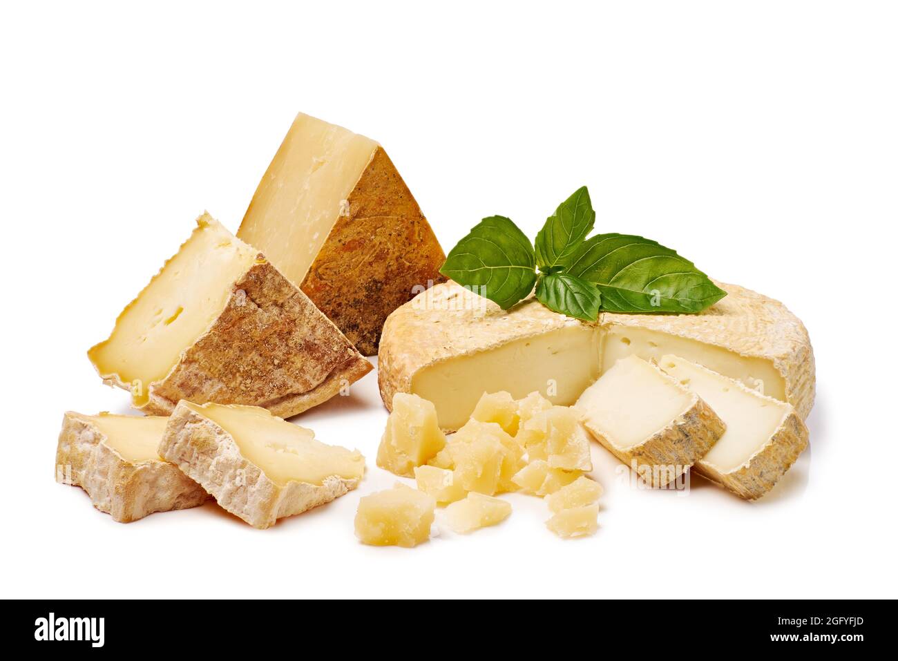 Pieces of various cheeses isolated on white background. Clipping path included Stock Photo