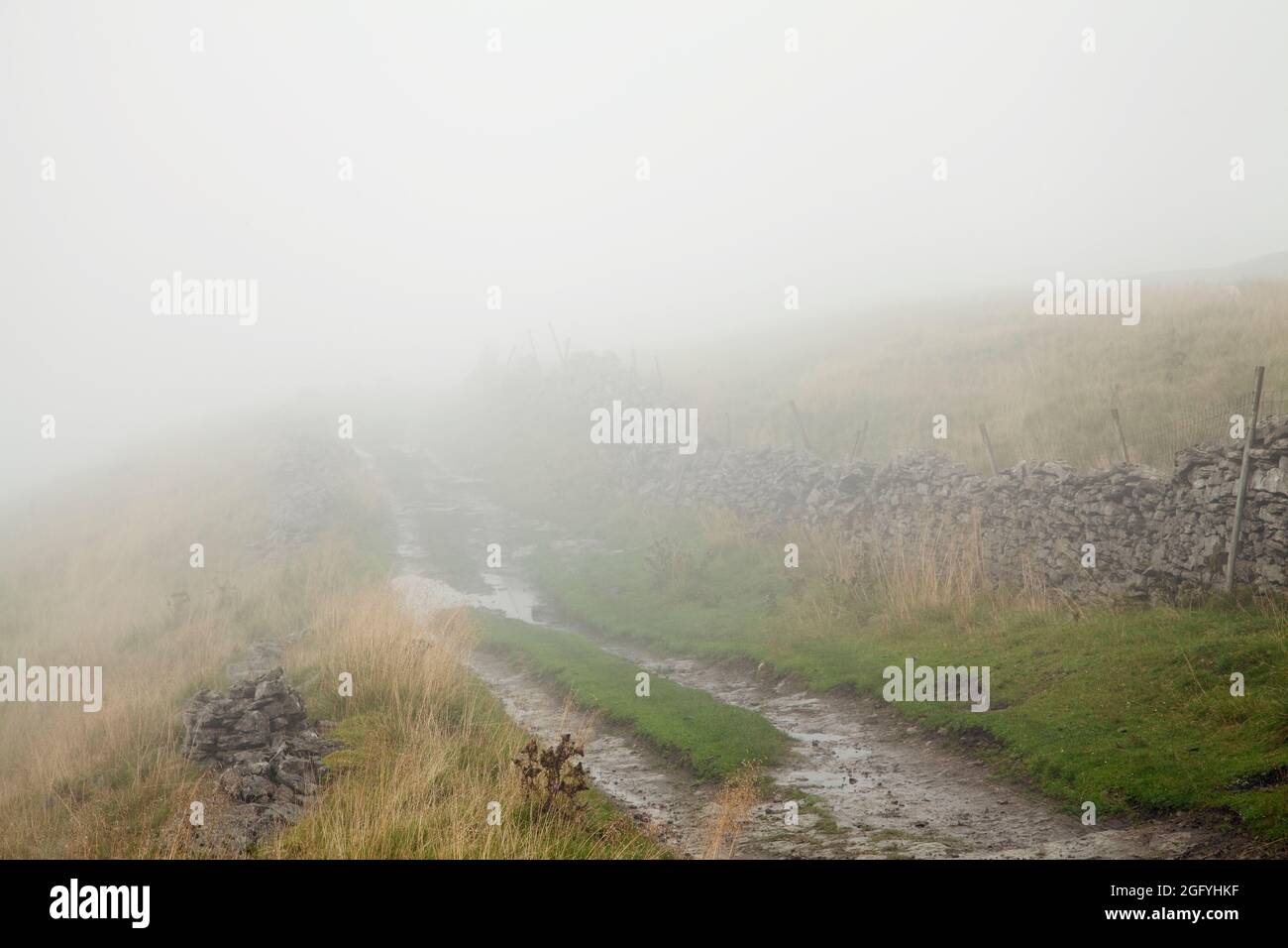 West Cam Road in mizzle, above Widdale in the Yorkshire Dales, UK Stock
