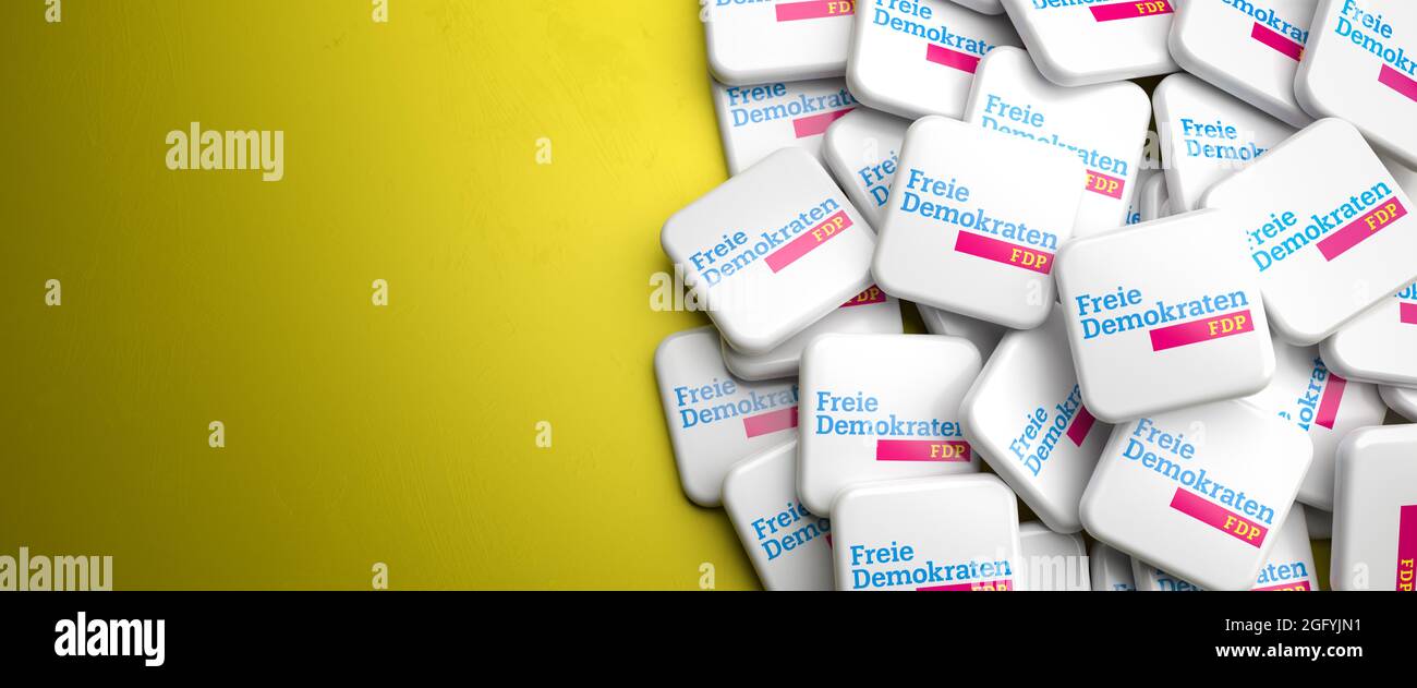 Logos of the liberal German political party FDP on a heap on a table. Copy space. Web banner format. Stock Photo