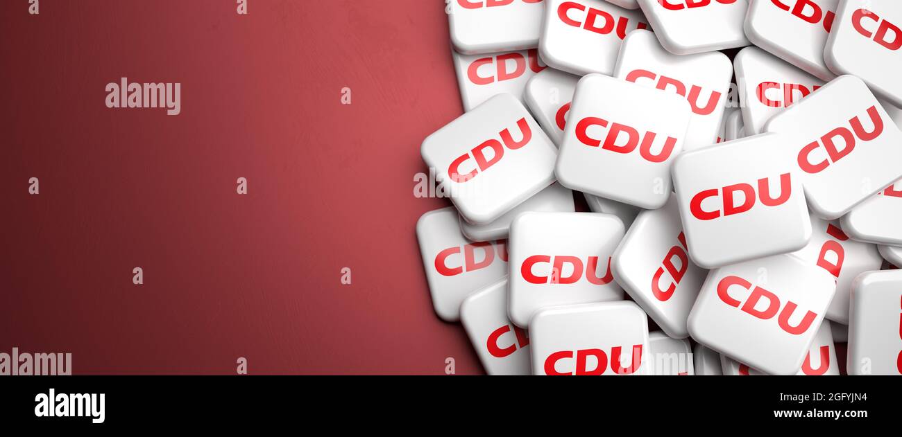 Logos of the conservative German political party CDU on a heap on a table. Copy space. Web banner format. Stock Photo