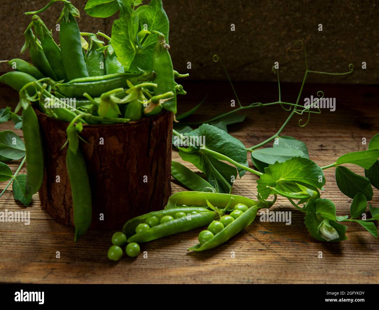 Fresh green peas pods, green peas with sprouts. Fresh vegetables. Stock Photo